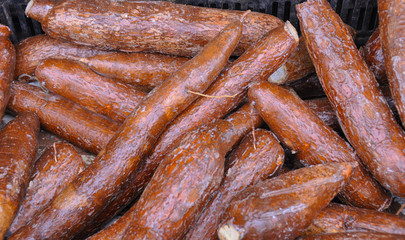 Fresh Yam shiny brown. Polished Yam root. Background.