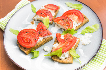 Brunch - wholemeal bread sandwich with tomato, cottage cheese and lettuce