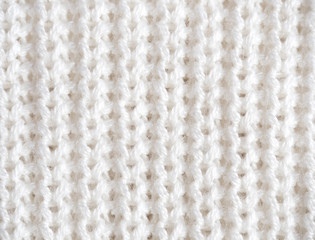 Knitted loops background. Part knitted sweater. Knitted texture. White Knitted Fabric Texture. White knitting wool texture background. Wool sweater texture close up