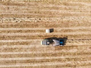 Nature and landscape, aerial view of fields with tractor with round baler and tractor with a rake,...