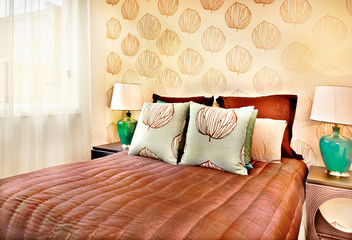 Modern brown color bed with pillows closeup in a luxury hotel or house
