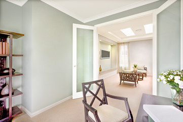 Modern house interior with carpet floor and wooden furniture