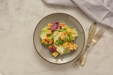 Healthy salad, caesar salad with croutons and dressing. Healthy foods.