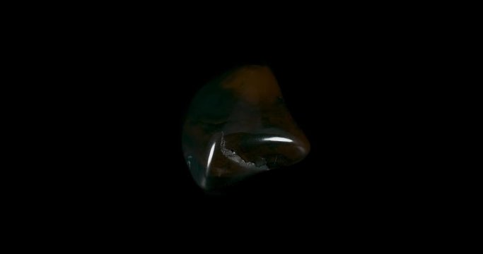 Red and Black Heliotrope Mineral Turning on Black