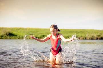 Girl  swimming in   warm river.