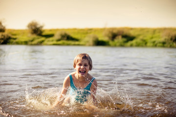 Girl  swimming in   warm river