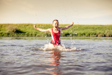 Girl  swimming  in river.