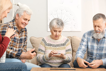 Happy senior people spending time together in nursing home