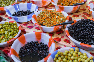 Pickles and olives at local market in Amman, Jordan. Middle East.