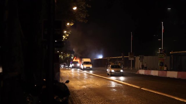 Paris, France - April 6, 2019: Fire in Paris with cars and firemens near Museum. Firefighter, Dark Smoke, burning fire, monument.