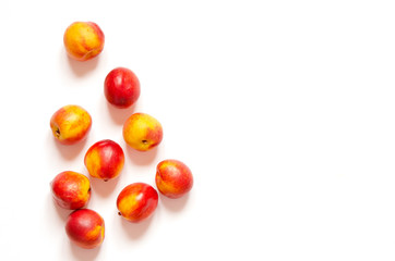 Ripe nectarines isolated on white background with copy space for your text. Top view. - Image