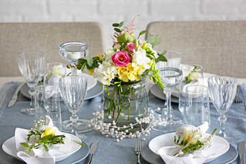 Beautiful table setting with fresh freesia flowers