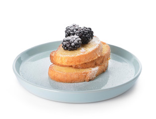 Plate with tasty French toasts and blackberry on white background