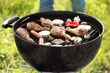 Cooking of tasty food on barbecue grill outdoors
