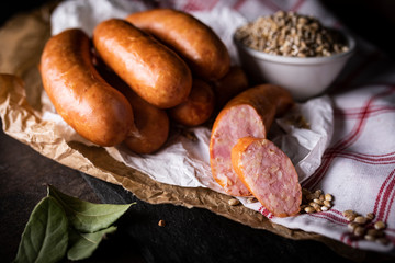 Smoked thin sausage. Traditional cuisine, meat composition