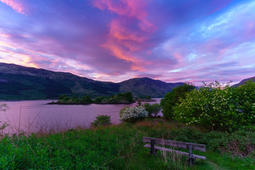 Eilean Munde or The burial island is a small island in Loch Leven in twilight , Glencoe , Scotland