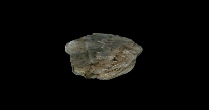 Grey Wollastonite Mineral Turning on Black