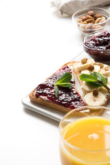 Sandwiches with berry jam, bananas without suga. Space for text. Close up. Healthy breakfast.