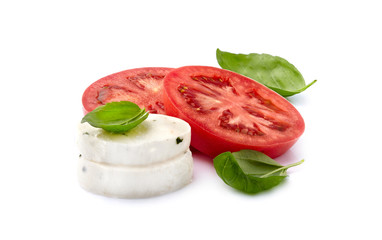 Fresh tomato with  basil leaves and mozzarella isolated on white background