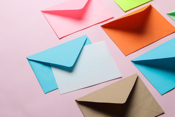 Multicolored envelope with blank for text on a bright trendy pink background. free space. - obrazy, fototapety, plakaty