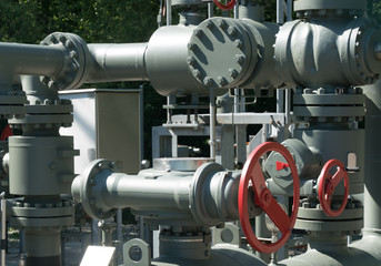 intricate system of metal pipes and valves and wheels used to regulate water and sewage