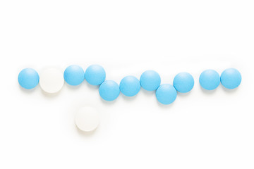 Health and medication concept blue and white pills drug or tablets on white background with copy space