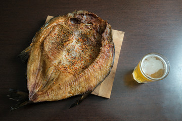 Close up horizontal view of smoked fish fillets with seasoning o