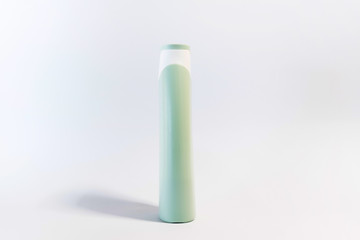 Blank plastic shampoo bottle on white background. Copy space for