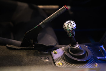 Manual gearbox in the sports car. Gear shifter inside a car.