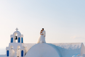 wedding couple from China on the island of Santorini, Oia village