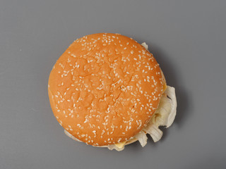 big burger with cutlet cheese tomato cabbage on gray background