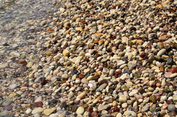 Wet pebbles by the sea