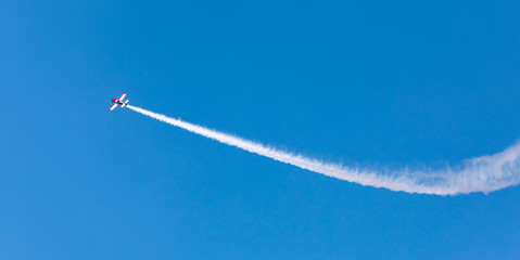 airplane with a trace of smoke
