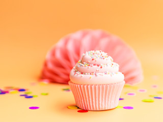 Delicious cupcake on beige background. Happy Birthday concept