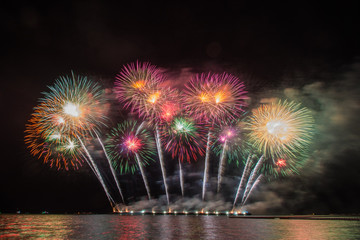 Beautiful firework display for celebration over the sea