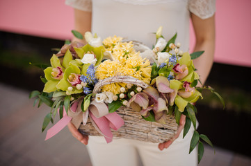 Close-up of girl with bouquet in flower basket