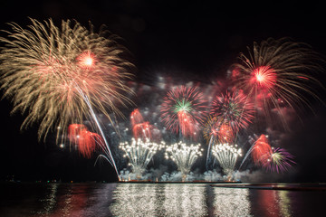 Fototapeta premium Beautiful firework display for celebration over the sea