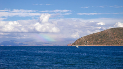 rainbow view on sun island in lake titicaca in Copacabana, Bolivia