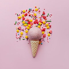 Ice cream on pastel colorful background with sweet glitter. Minimal summer concept. Flat lay.
