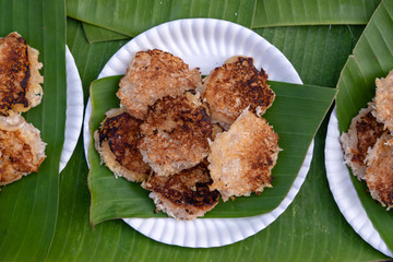 Coconut-rice pancakes , coconut pudding is traditional Thai dessert or kind of sweet meat made from rice flour and coconut milk at street food market in Thailand