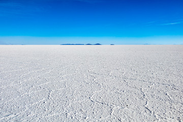 Landscape of incredibly white salt flat Salar de Uyuni, amid the Andes in southwest Bolivia, South America