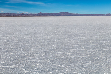 Landscape of incredibly white salt flat Salar de Uyuni, amid the Andes in southwest Bolivia, South America