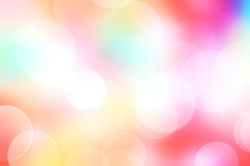 Fototapeta premium Colorful rainbow holiday blurred bokeh background.Pink yellow texture.