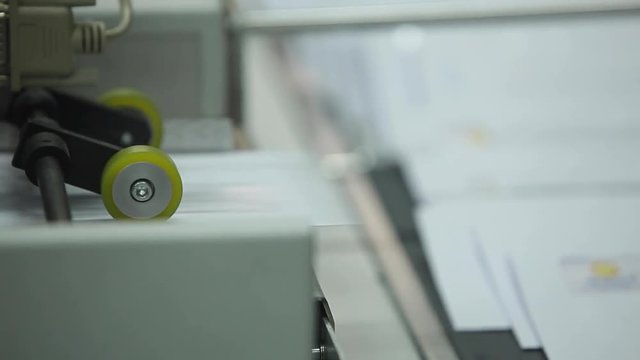 Letter envelopes Printing Rolls with High speed labeling machine in industrial factory, sticker on product in manufacture. Flexible packaging. Close-Up Macro. Loop.