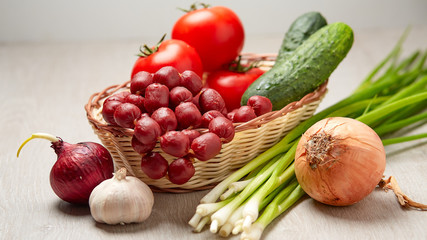 Basket with sausage and vegetables
