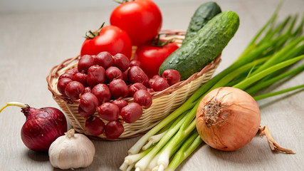 Basket with sausage and vegetables