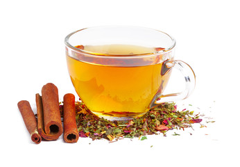 Black tea in a cup of glass. Mint and tea leaves. On white, isolated background