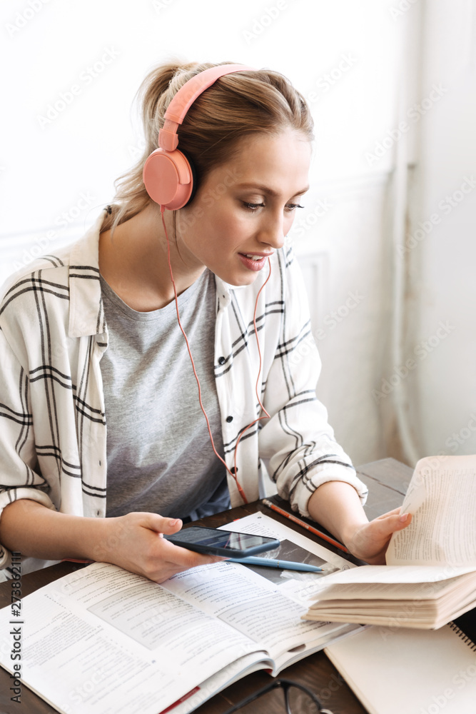 Poster attractive young girl student doing homework