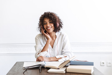 Attractive young girl student doing homework