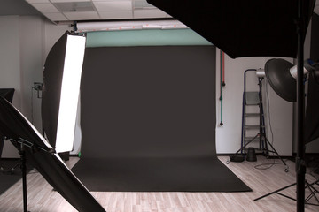 Empty photographic Studio with modern lighting equipment.